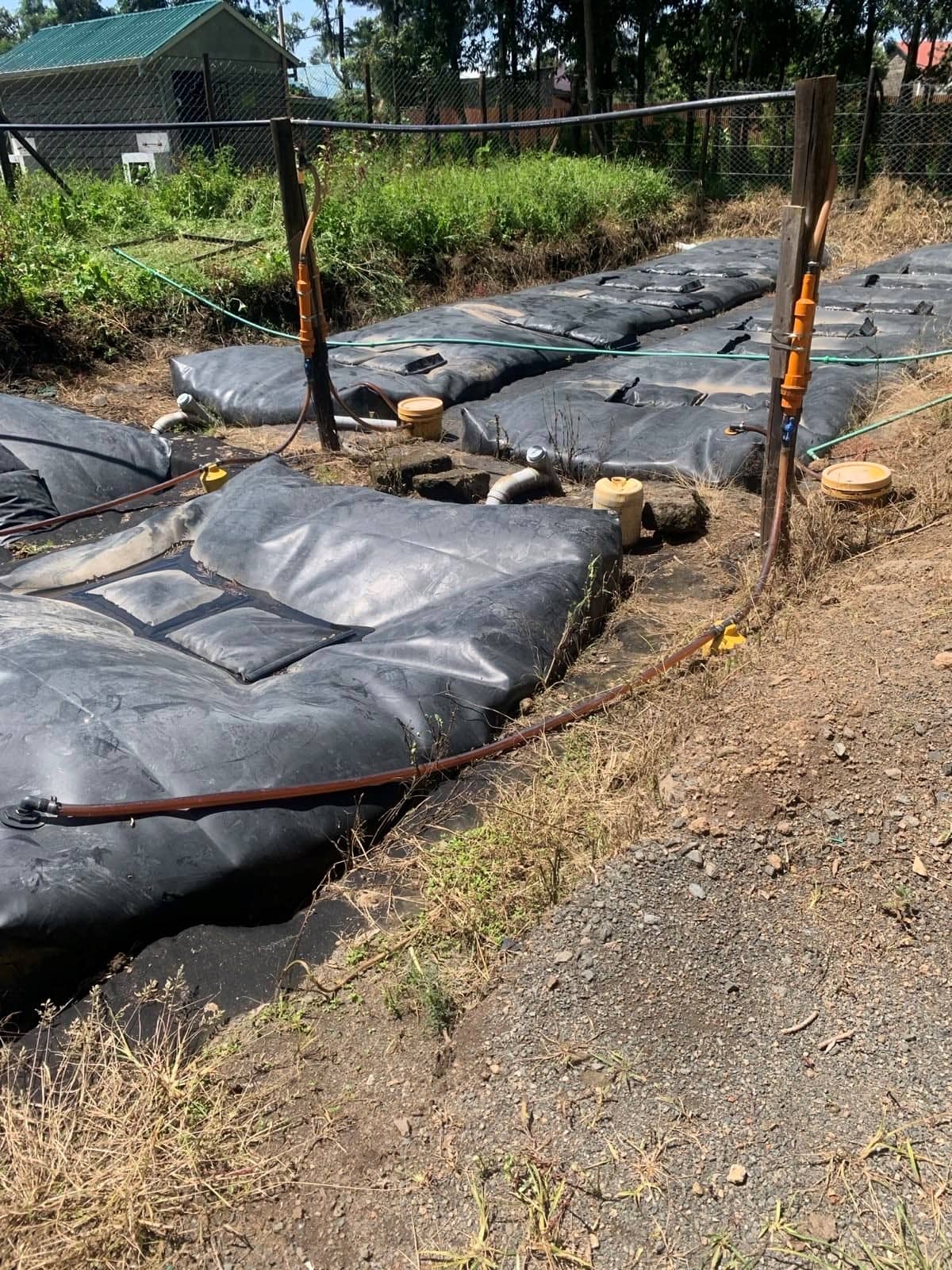 Series of bags and pipes belonging to a cooking gas filter system.